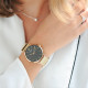 Modern and simple design watch with black dial and golden milanese mesh bracelet by Elsa Lee Paris 