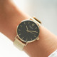 Modern and simple design watch with black dial and golden milanese mesh bracelet by Elsa Lee Paris 