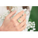 green cushion-cut solitaire ring with accompanying white zirconia half-pavé setting Elsa Lee Paris