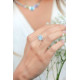 Blue cabochon solitaire halo ring with white pavé stones in sterling silver Elsa Lee Paris